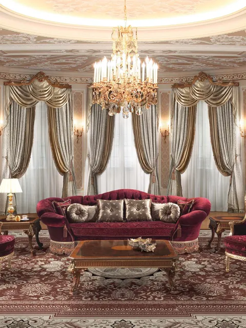 Divano e poltrone Angelo Cappellini in velluto bordeaux in un salone con colonne, ispirazione per il salotto di una villa classica