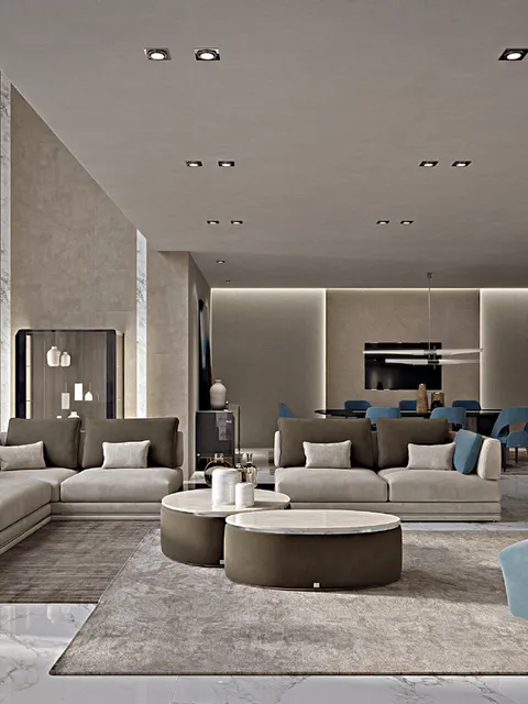 Divani Icon di Francesco Pasi grigi con poltrone blu e pouf rotondi, idea per un soggiorno moderno open space