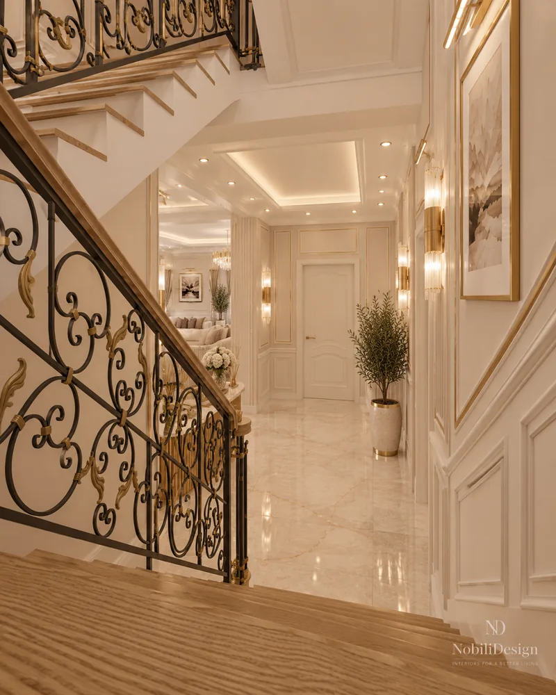 Staircase view down to the hall with scrolled wrought iron railing, marble floor and panelled walls