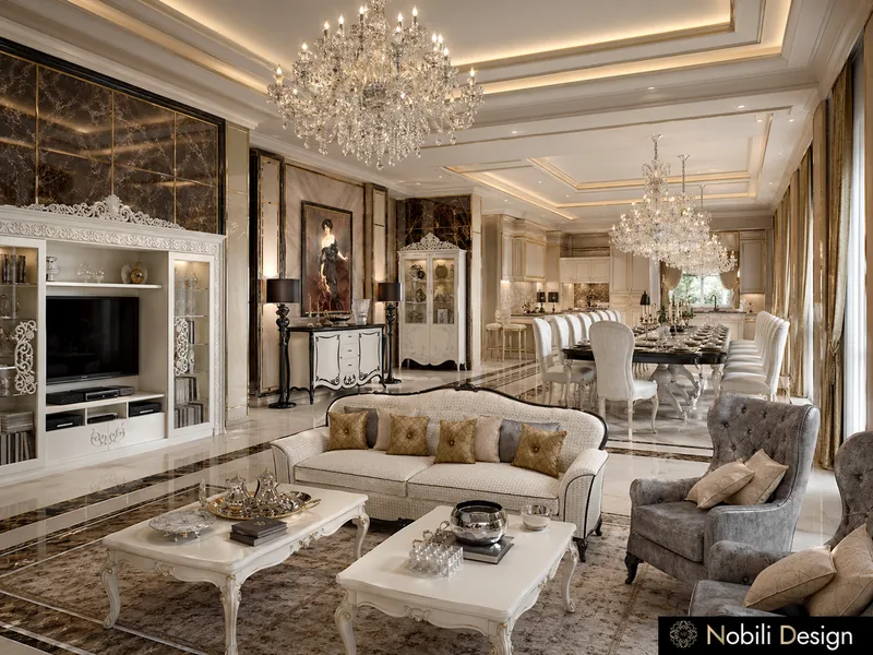 Classic villa living room open to the dining room, with carved coffee tables and crystal chandeliers