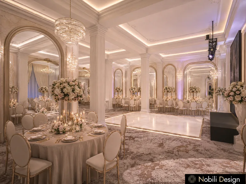 Wedding hall table with rose centrepiece and candles beside a lit dance floor and gold-framed arched mirrors
