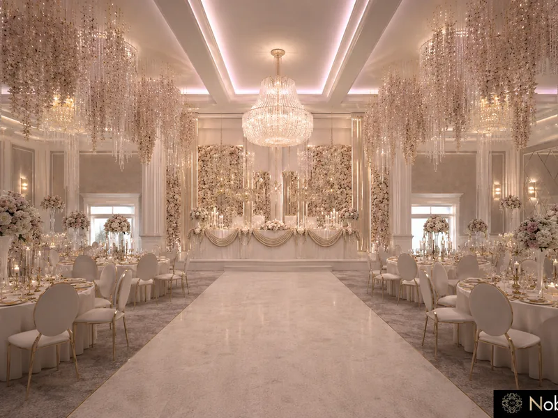 Ballroom aisle between round tables with rose centrepieces under crystal chandeliers and hanging blossom strands