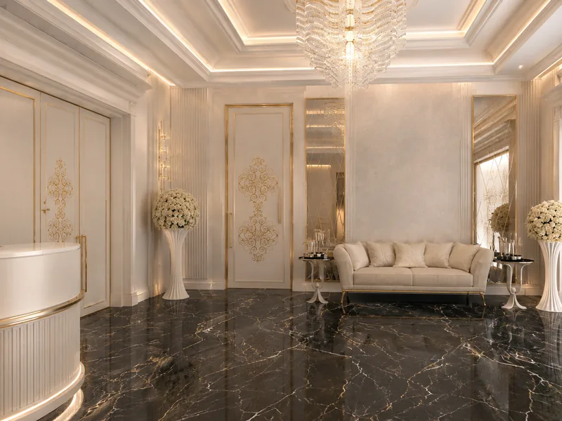 Wedding venue reception lounge with ivory sofa, black marble floor and lit carved panels