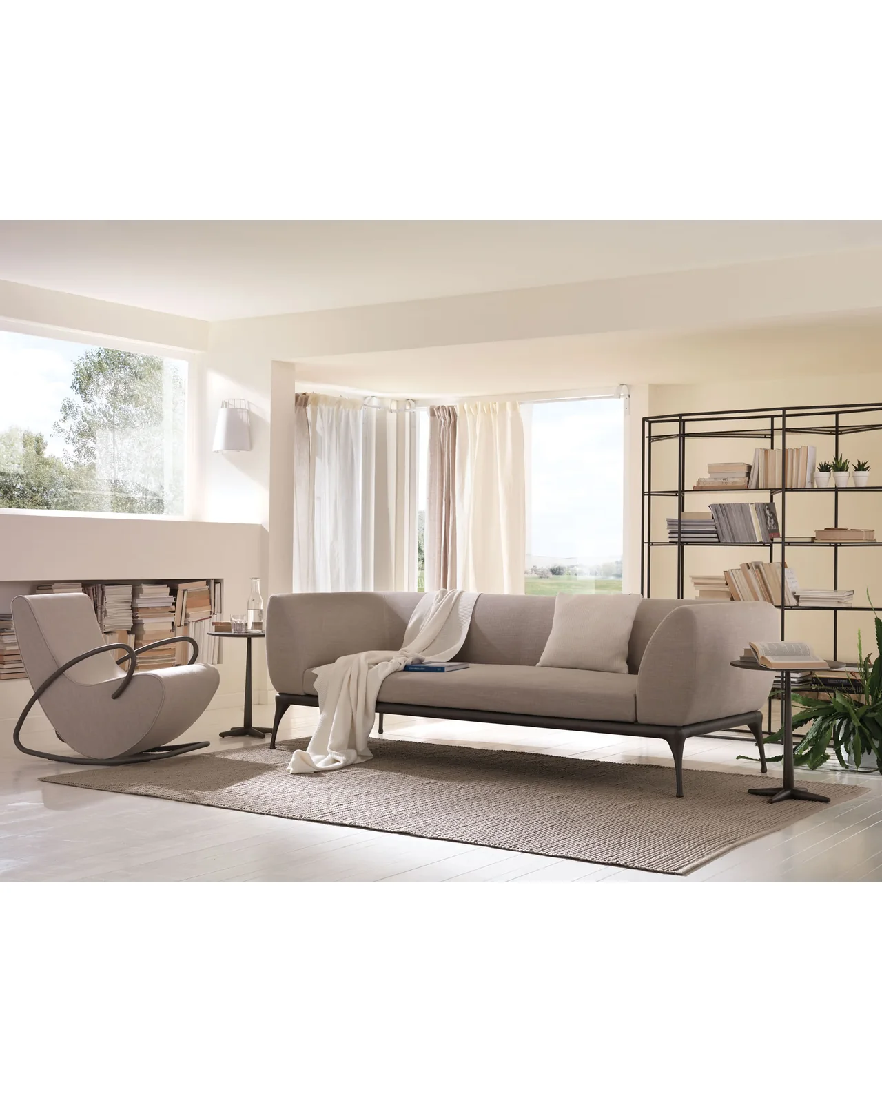 Camilla rocking armchair by Cantori, in an interior setting, photo 8 of 9