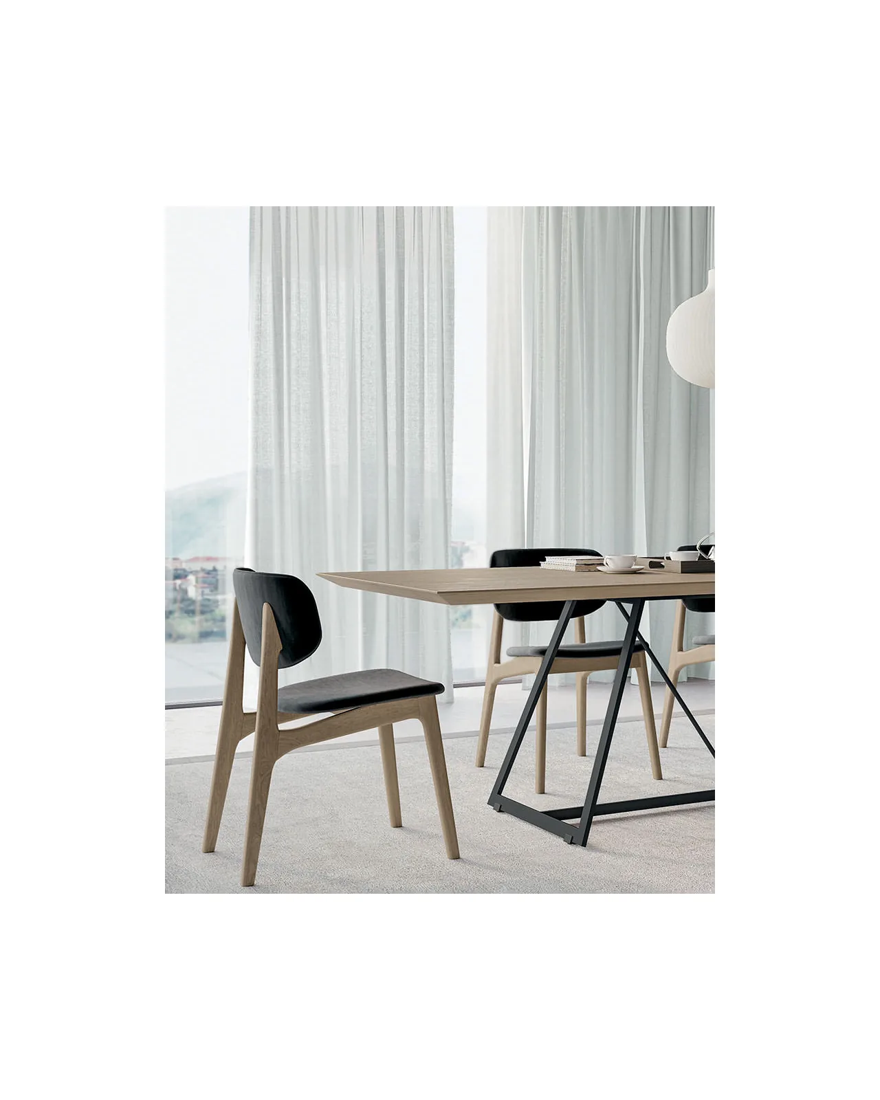 Float dining chair by Dall'Agnese, in an interior setting, photo 3 of 4