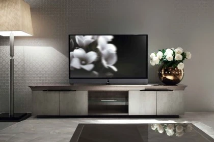 Sleek TV base unit providing a minimalist platform for media equipment in a refined living room.