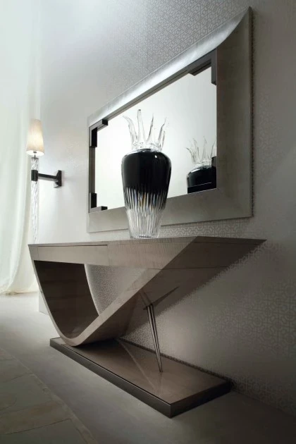 Slim Alchemy console table placed against a wall to display art and decorative living objects.