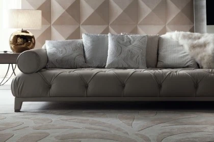 Contemporary fixed sofa with plush upholstery designed as a central statement piece for living rooms.