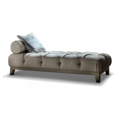 Elegant Masami chaise longue offering a sculptural profile and high-end comfort for a relaxation area.
