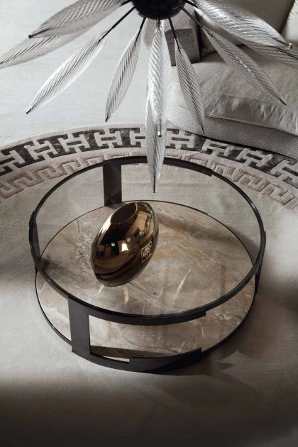 Modern oval coffee table showcasing metallic details and a smooth surface for refined interior styling.