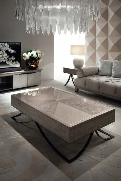 Low-profile rectangular coffee table with a warm wood finish and contemporary architectural design elements.